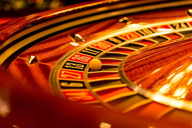 Live casino dealer and roulette table with multi-camera setup
